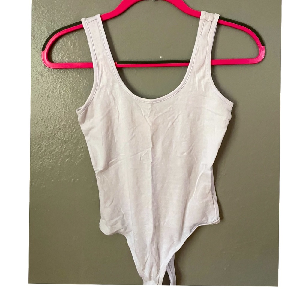 Small plain white cotton body suit